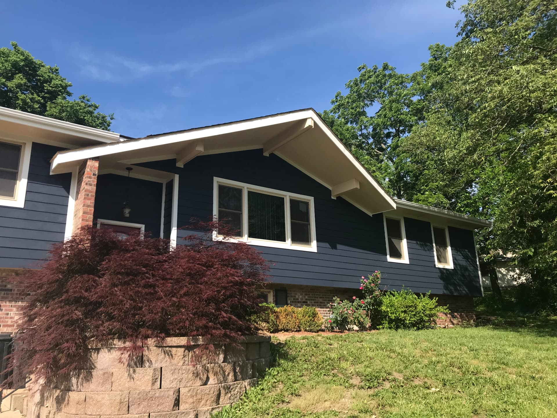 Navy siding and white trim