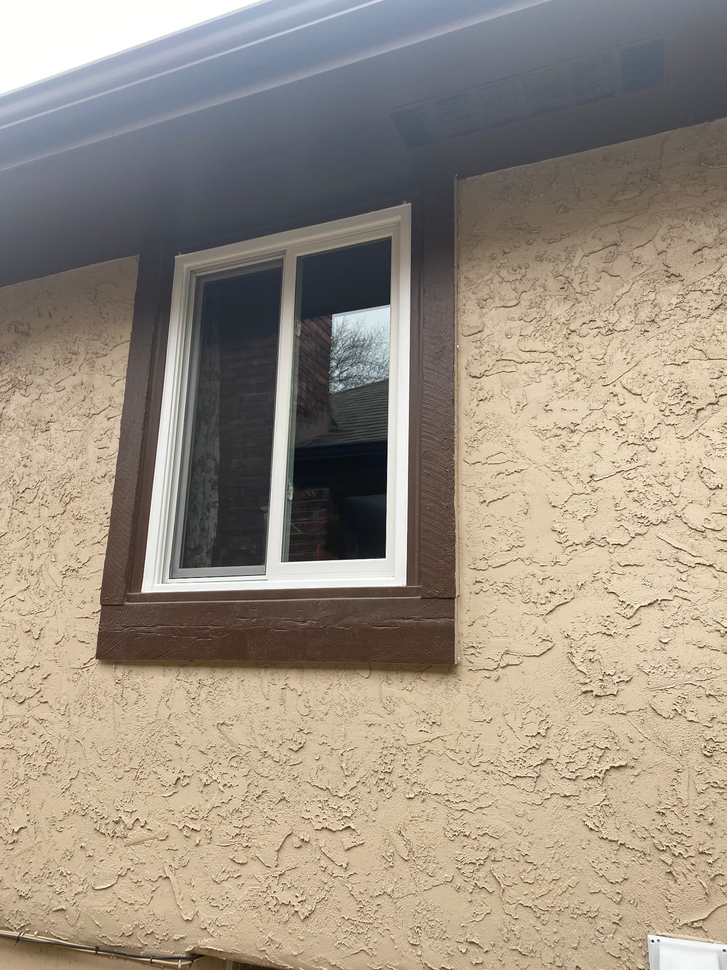 Sliding window on a stucco wall